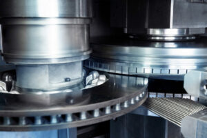 Double-sided face-grinding of coated brake wheels