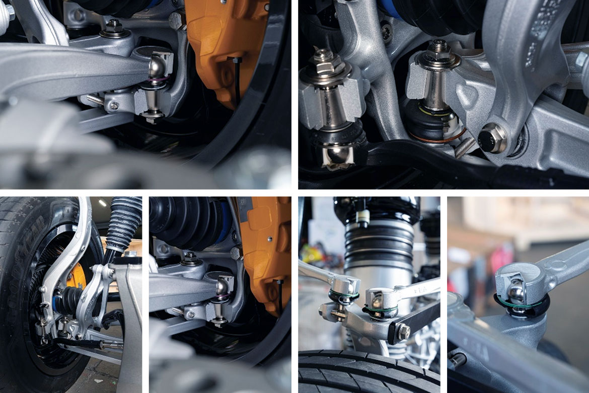 Ball joints and ball pins in a vehicle chassis, mounted on control arms and steering knuckles.