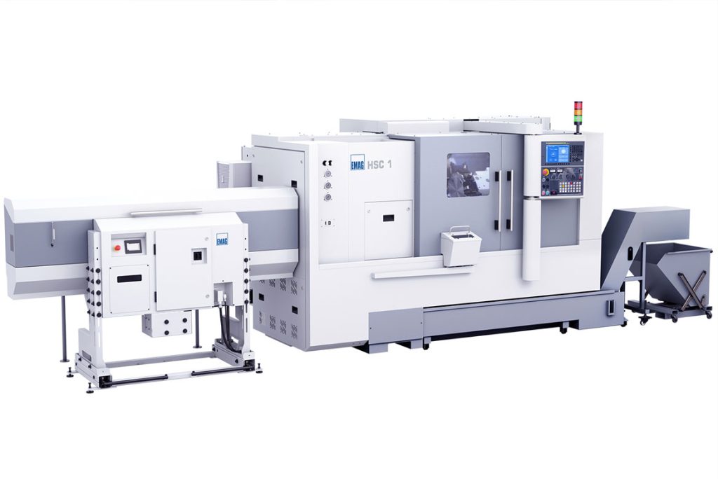 Vista de la HSC 1 con alimentador de barras conectado para la alimentación automática de material y transportador de virutas integrado.